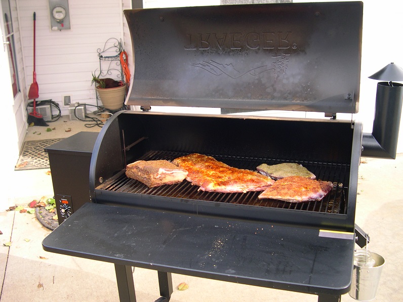 cooking on the grill with E D in background.JPG